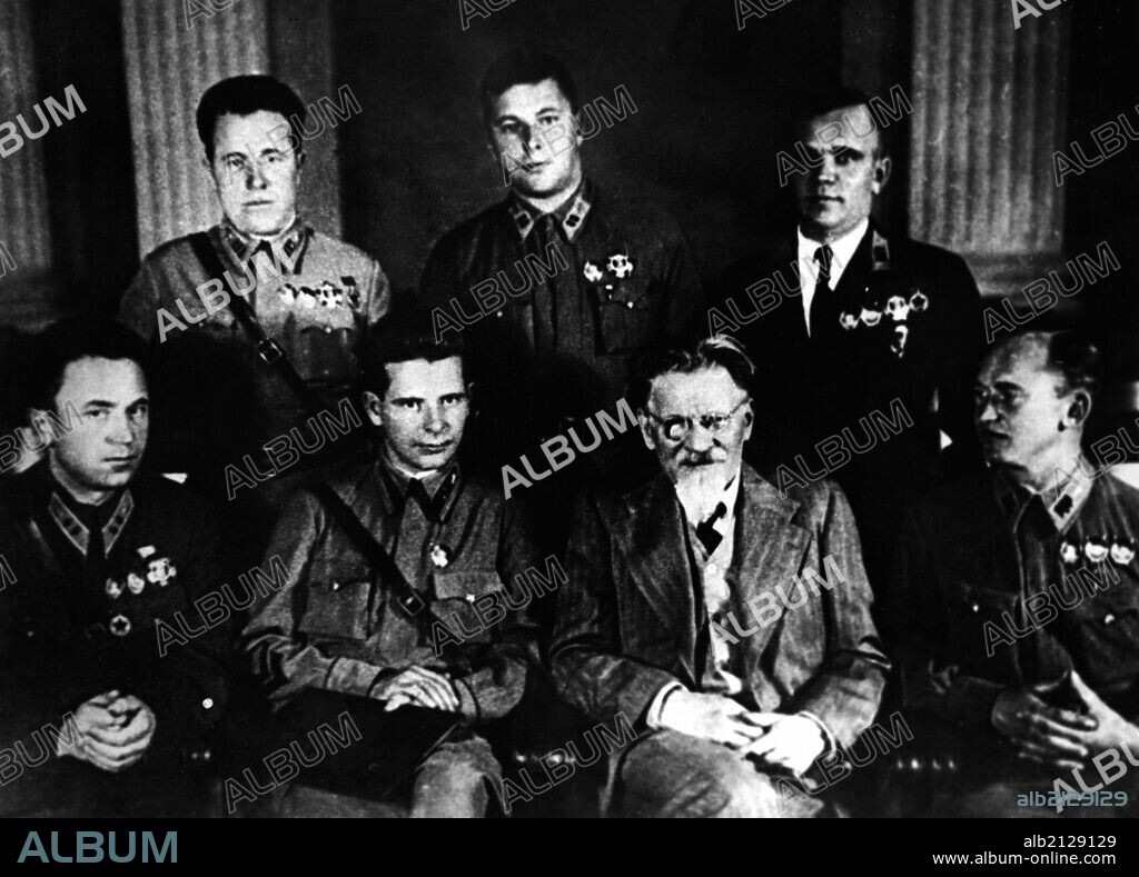 Moscow, october 7, 1939, chairman of the presidium of the ussr supreme soviet mikhail kalinin awards heroes of the battles on the khalkhin-gol river, from left to right: heroes of the soviet union s, p, denisov, i, n, dushkin, k, n, abramov, n, s, gerasimov, v, i, shevchenko and i, a, lakeyev.