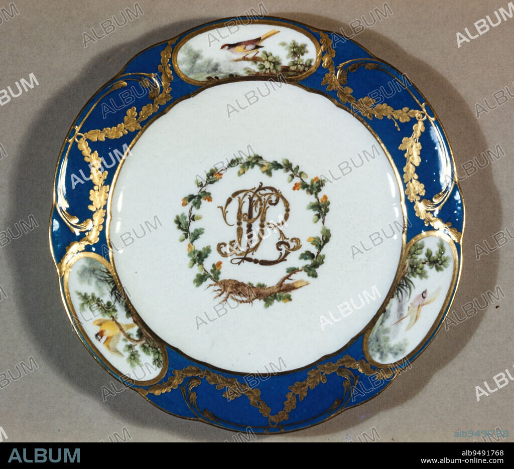 Dinner plate from the Rohan service, 1771, Antoine-Joseph Chappuis; Manufacturer: Sèvres Porcelain Factory, French, 1743-87, 1 x 9 5/8 in. (2.54 x 24.45 cm), Porcelain, enamel, gilding, France, 18th century, The various objects displayed on the shelves are part of a 360-piece dinner and dessert service made for Louis-Rene-Edouard, Prince de Rohan, Cardinal of France (1734-1803), for his embassy in Vienna. Included here are an ice cream pail, which chilled creams and sorbets, a pair of cream cups, a tray with preserve or jam pots, dinner plates, and dessert plates. Several skilled artisans decorated the objects, including Antoine-Joseph-Chappuis, Etienne Evans, and Francois-Joseph Aloncle.