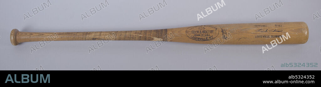 African-American baseball player Frank Robinson (1935-2019) was the only player to be named Most Valuable Player (MVP) of both the National League (NL) and the American League (AL). Model R161 wood bat with black writing on side. Black type near center of bat reads, [LOUISVILLE SLUGGER® / 125 / HILLERICH & BRADSBY Co / MADE IN U.S.A. / LOUISVILLE, KY. / Powerized]. Type near end opposite of handle reads, [GENUINE / R161 / Frank Robinson / LOUISVILLE SLUGGER]. The bat is cracked one third of the way up from the handle.