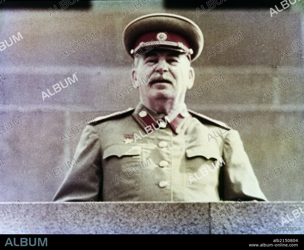 Joseph stalin watching the may day parade from lenin's tomb in red square, moscow, ussr, 1952, (still from a news reel) .
