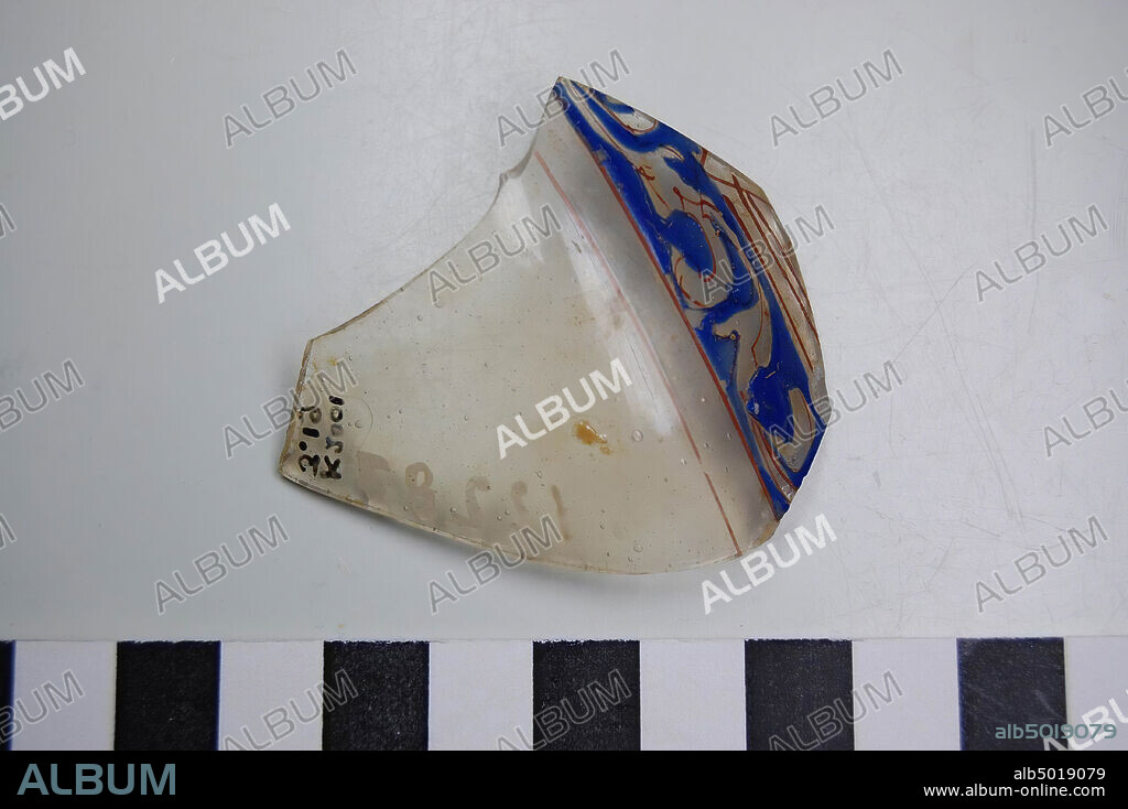 Glass shard with blue, red and gold decoration. Transparent glass with air bubbles. Old inventory number: 12287., shard, glass, 5.5 x 4.8 cm, Roman 50-100, unknown.