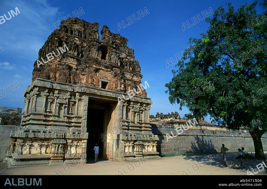 The Vittala Temple, built in the early 16th century, is devoted to the Hindu god Vithoba (also known as Vitthala and Panduranga), an incarnation of Vishnu or his avatar Krishna. Hampi is a village in northern Karnataka state. It is located within the ruins of Vijayanagara, the former capital of the Vijayanagara Empire. Predating the city of Vijayanagara, it continues to be an important religious centre, housing the Virupaksha Temple, as well as several other monuments belonging to the old city.