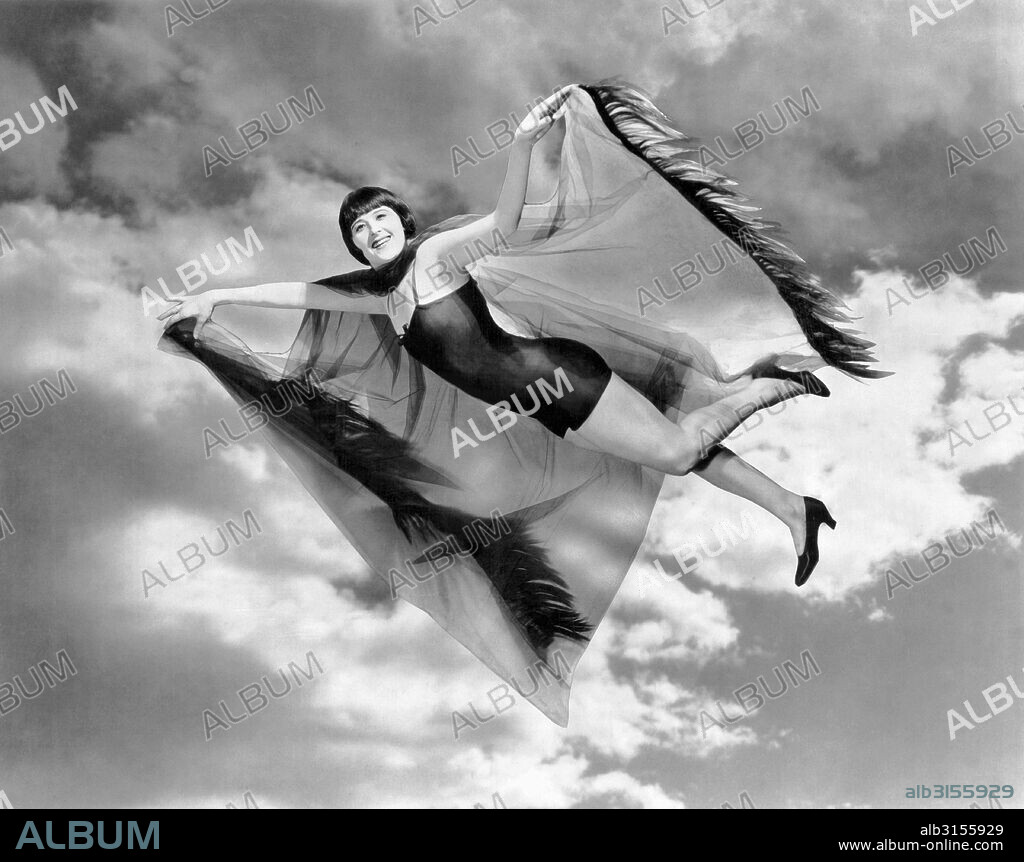 Culver City, California:  1924 Margaret Livingston, star of the Ralph Ince Production, 'The Chorus Lady', takes a Halloween trip to the moon.