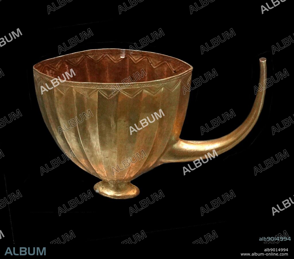 Sumerian gold cup from Ur, southern Iraq; about 2600-2400 BC. Found in the 'Queen's Grave'; this gold cup was one of four vessels found on the floor of the pit of the Queen's Grave in the Royal Cemetery at Ur. They were lying alongside the sacrificial victims.