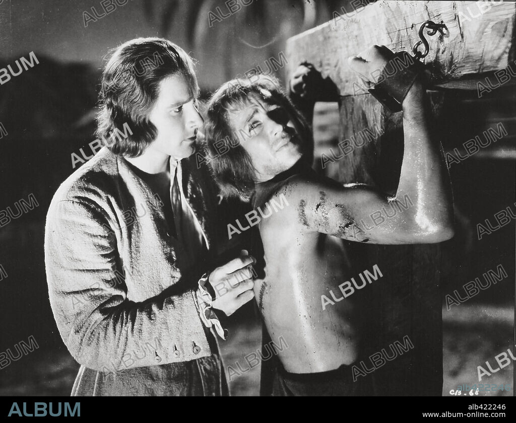 ERROL FLYNN and ROSS ALEXANDER in CAPTAIN BLOOD, 1935, directed by MICHAEL CURTIZ. Copyright WARNER BROS/FIRST NATIONAL.