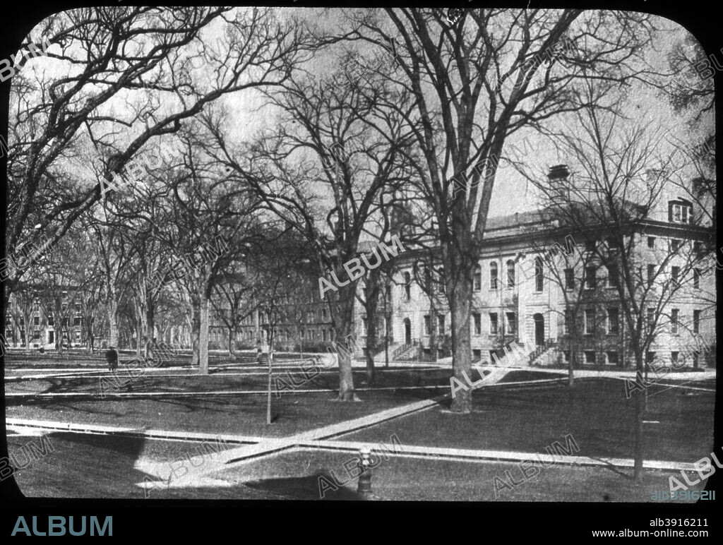 Harvard University, Cambridge, Massachusetts, USA, late 19th or early 20th century. Founded in 1636, Harvard University is named after its first major donor, John Harvard, a clergyman and graduate of Emmanuel College, Cambridge, who bequeathed several hundred pounds and a collection of books which formed the basis of the university's library. A statue of him stands in Harvard Yard. Lantern slide.