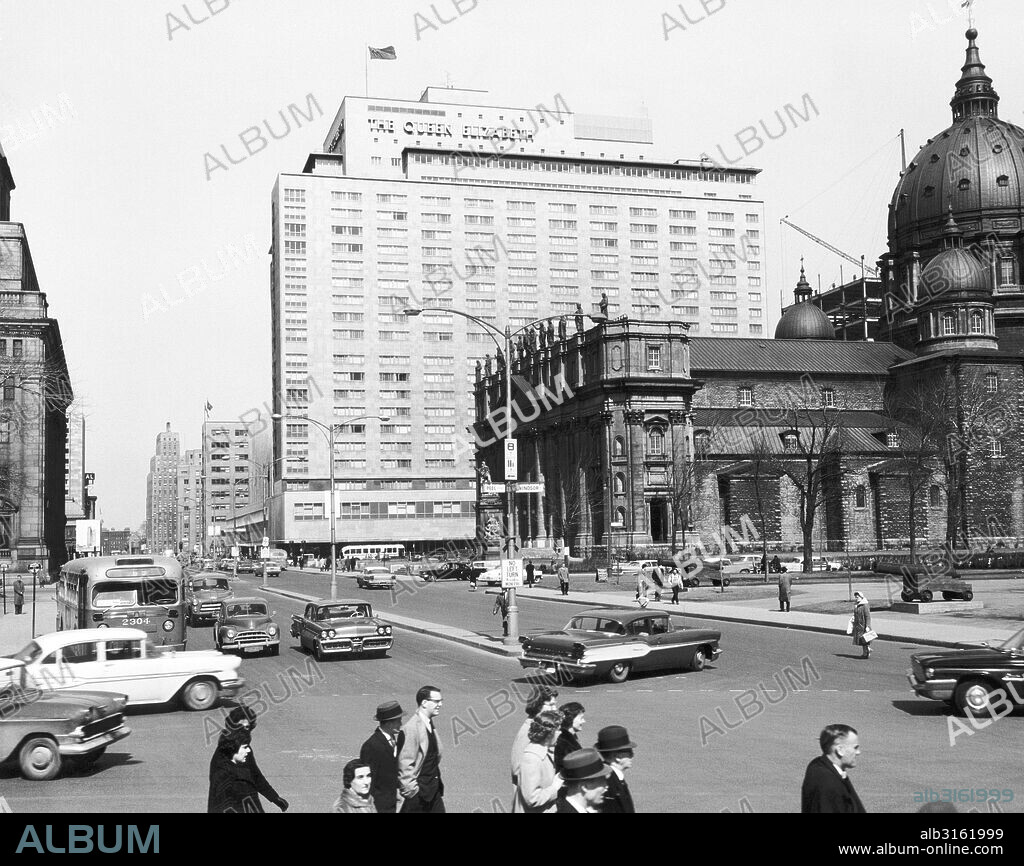 Montreal, Quebec, Canada: c. 1959. A scene in Montreal. The Mary Queen of the World Cathedral-Basilica is to the right, and Canada's newest and most modern hotel, the Queen Elizabeth, rises in the background.