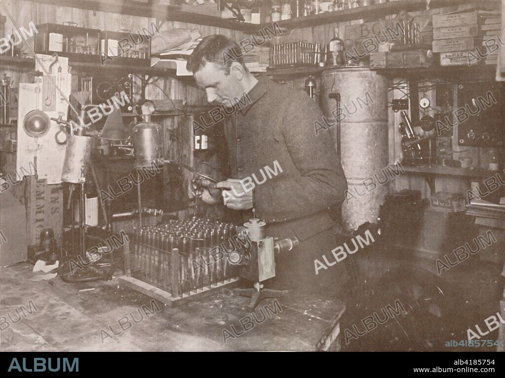 'Dr. Simpson in his Laboratory', 21 December 1911, (1913). Meteorologist George Simpson (1878-1965) took detailed measurements in order to predict the best possible conditions for Scott's journey to the Pole. The final expedition of British Antarctic explorer Captain Robert Falcon Scott (1868-1912) left London on 1 June 1910 bound for the South Pole. The Terra Nova Expedition, officially the British Antarctic Expedition (1910-1913), included a geologist, a zoologist, a surgeon, a photographer, an engineer, a ski expert, a meteorologist and a physicist among others. Scott wished to continue the scientific work that he had begun when leading the Discovery Expedition to the Antarctic in 1901-04. He also wanted to be the first to reach the geographic South Pole. Scott, accompanied by Dr Edward Wilson, Captain Lawrence Oates, Lieutenant Henry Bowers and Petty Officer Edgar Evans, reached the Pole on 17 January 1912, only to find that the Norwegian expedition under Amundsen had beaten them to their objective by a month. Delayed by blizzards, and running out of supplies, Scott and the remainder of his team died at the end of March. Their bodies and diaries were found eight months later. From Scott's Last Expedition, Volume II. [Smith, Elder & Co., London, 1913].