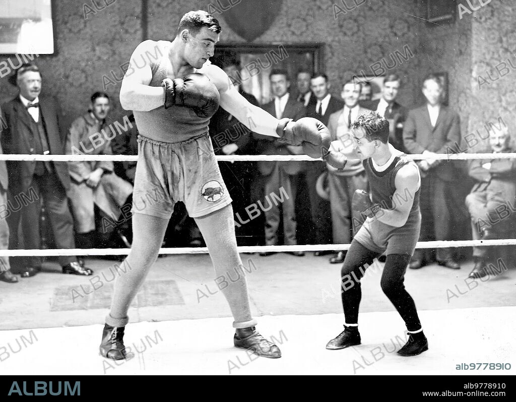 Windsor (England), October 1929. The 22-year-old Italian boxer Primo Carnera training with Frankie Generao, world flyweight champion, in preparation for the fight on the 17th against Jack Stanley.