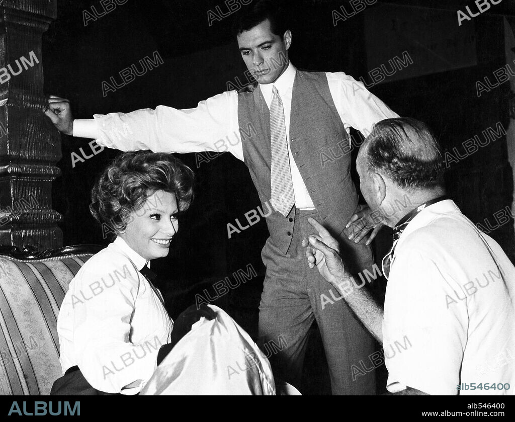 JOHN GAVIN, MICHAEL CURTIZ and SOPHIA LOREN in A BREATH OF SCANDAL, 1960, directed by MICHAEL CURTIZ. Copyright PARAMOUNT PICTURES.