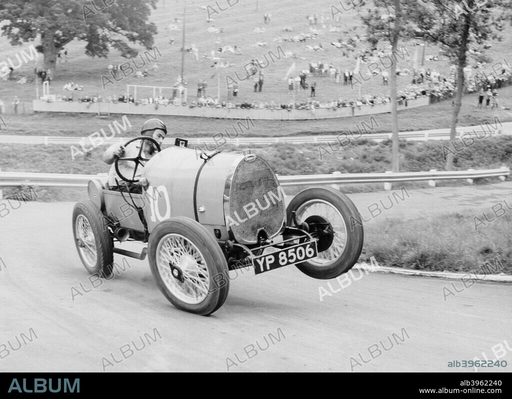 Bugatti T13 Brescia in action, Prescott Hill Climb, Gloucestershire.The left front wheel of this Bugatti leaves the ground as the driver, H Moffat, negotiates a sharp bend. Bugatti Brescias were manufactured between 1914 and 1920.