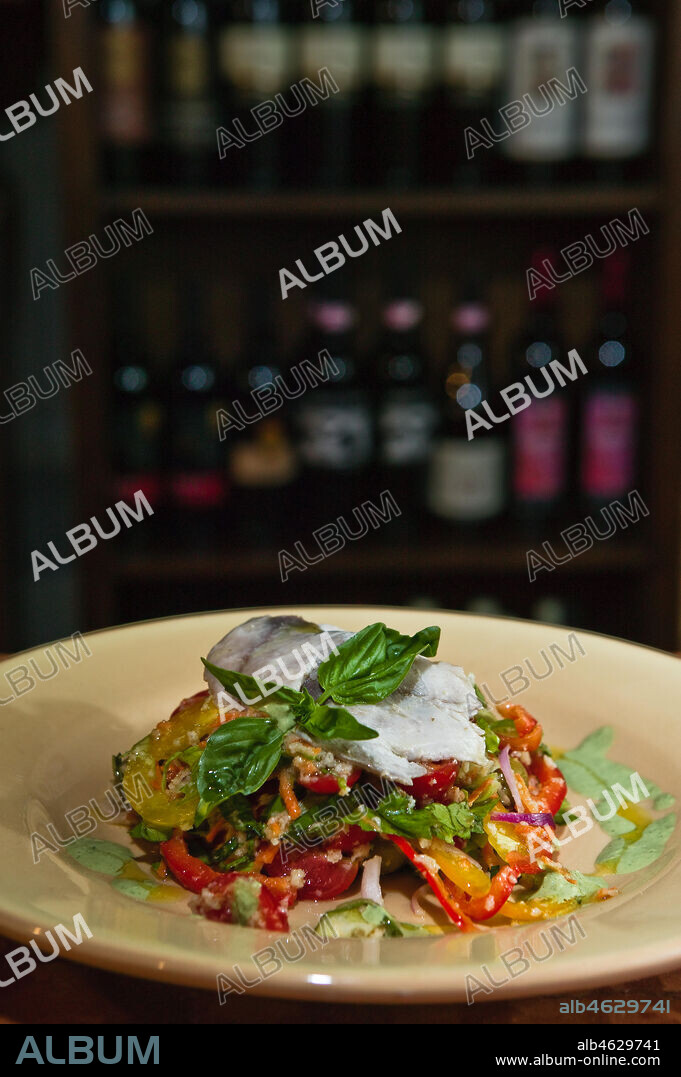 Bevagna, the "Bottega Di Piazza Onofri", wine shop and restaurant: a dish of mozzarella cheese with vegetables (tomato) and basil.