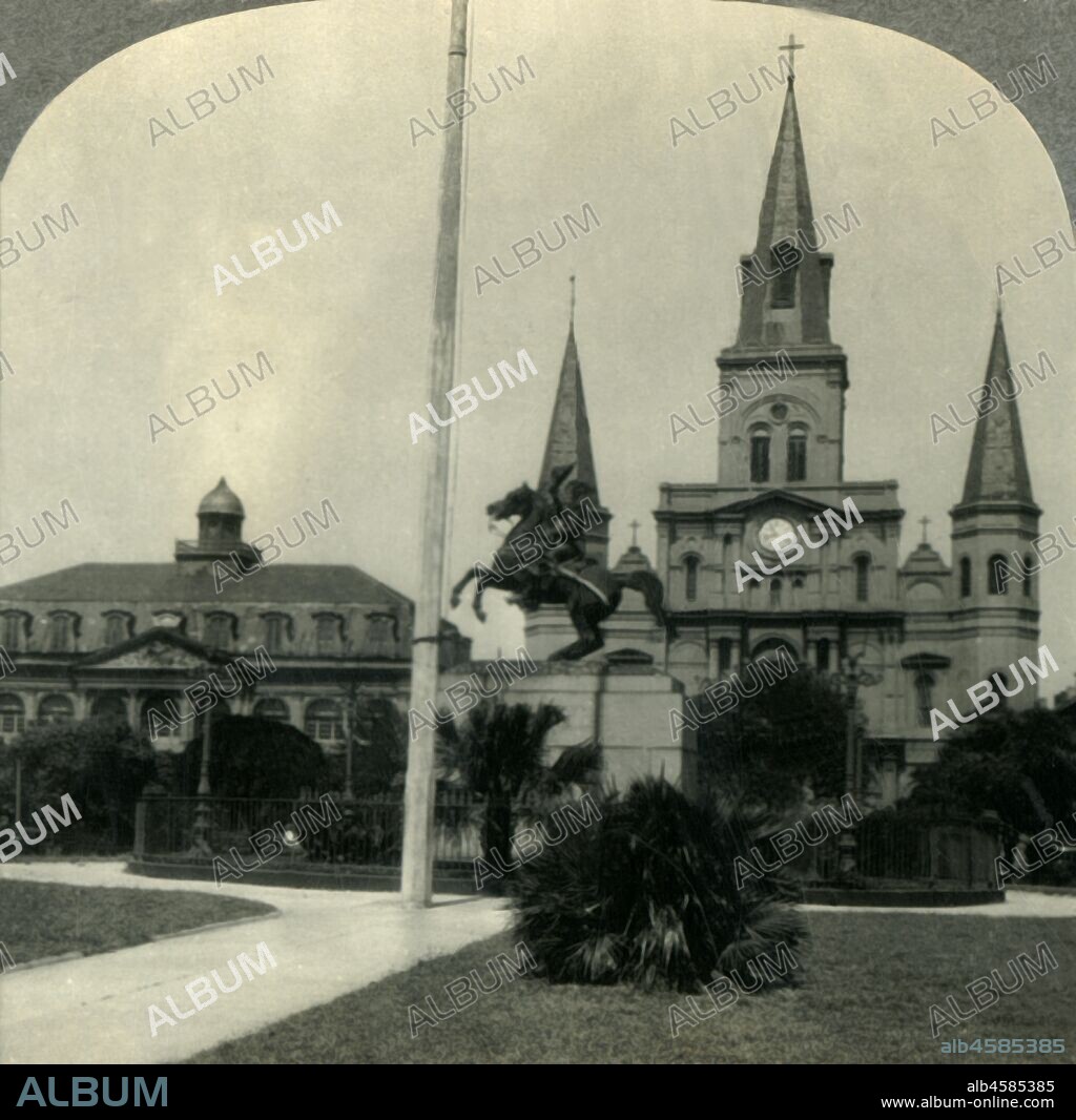 'In Historic Old New Orleans, La. - Jackson Square, the Site of Bienville's "Place d'Armes".', c1930s. St Louis Cathedral in historic Jackson Park in the French Quarter of New Orleans with equestrian statue of General Jackson by Clark Mills, became a National Historic Landmark in 1960. From "Tour of the World". [Keystone View Company, Meadville, Pa., New York, Chicago, London].