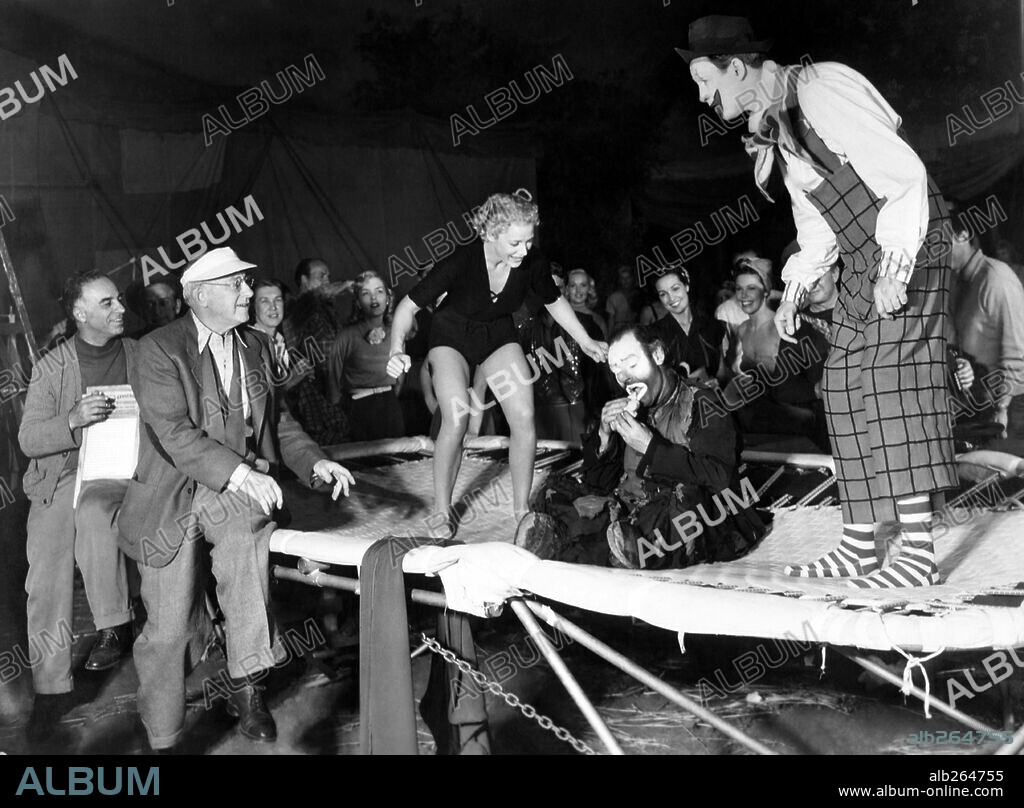 Cecil B. DeMille, BETTY HUTTON and JAMES STEWART. BETTY HUTTON, CECIL B DEMILLE and JAMES STEWART in THE GREATEST SHOW ON EARTH, 1952, directed by CECIL B DEMILLE. Copyright PARAMOUNT PICTURES.