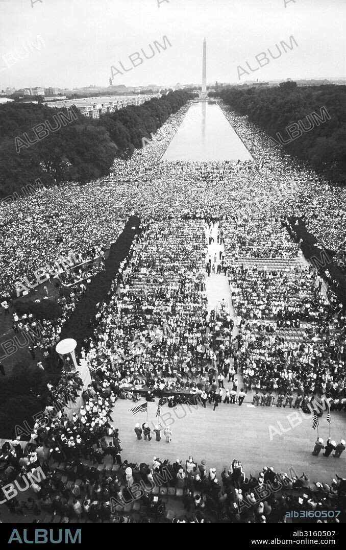 Washington, D.C.: August 28, 1963 The civil rights march on Washington showing crowds of people on The Mall, starting at the Lincoln Memorial, going around the Reflecting Pool, and continuing to the Washington Monument.