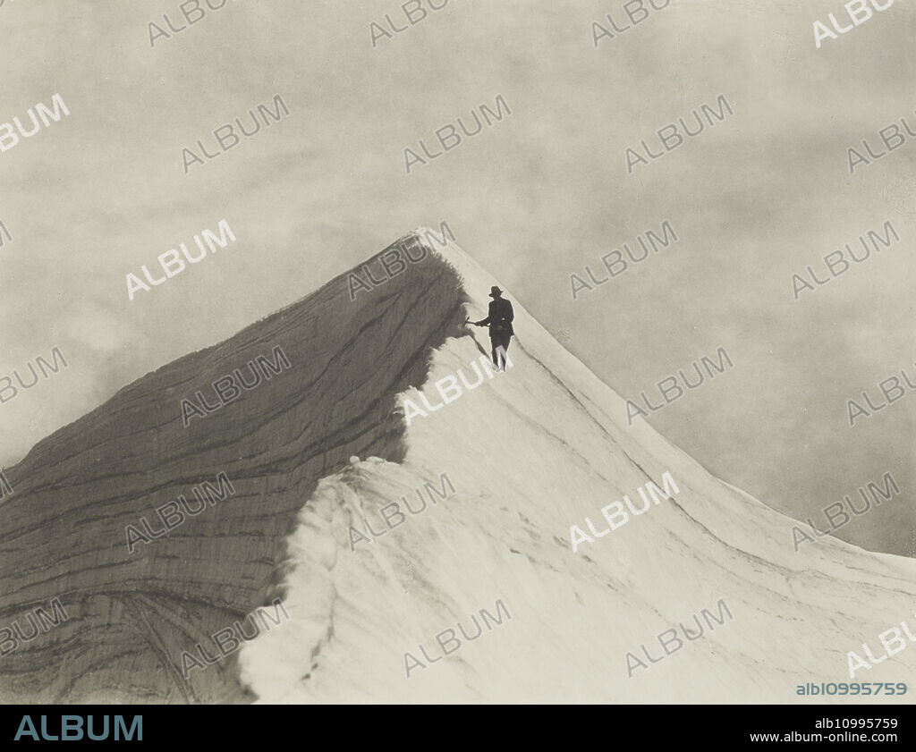 HARRY MOULT. Traversing Annette wind ridge by chief guide F. Milne, Mt Cook district. From the album: Record Pictures of New Zealand, 1920s.