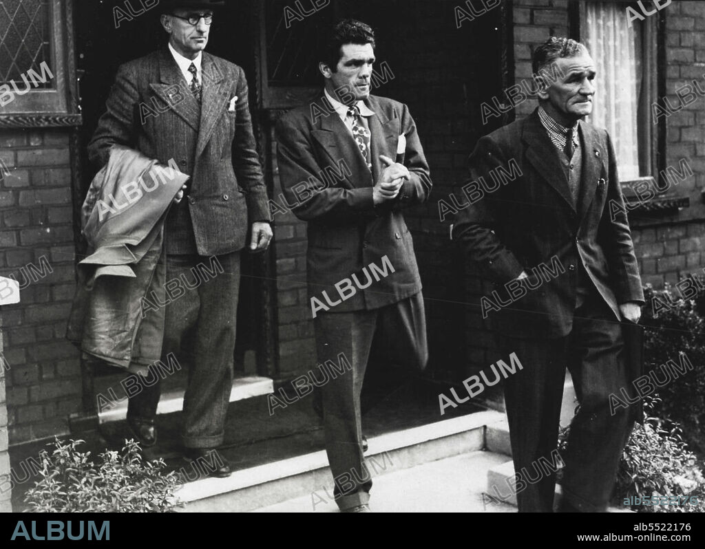 Champion Sees Specialist -- Freddie Mills (centre) ***** manager Ted Broadribb (right), carrying the champion's X-Ray films - and an official of the British Boxing Board of Control, leaving to see a London special list this evening.Freddie Mills 28-year-old world light heavyweight boxing champion was told to-night the ***** will be able to box again. so he ***** not, as feared, have to give up ***** ring through spinal injuries. August 20, 1948.