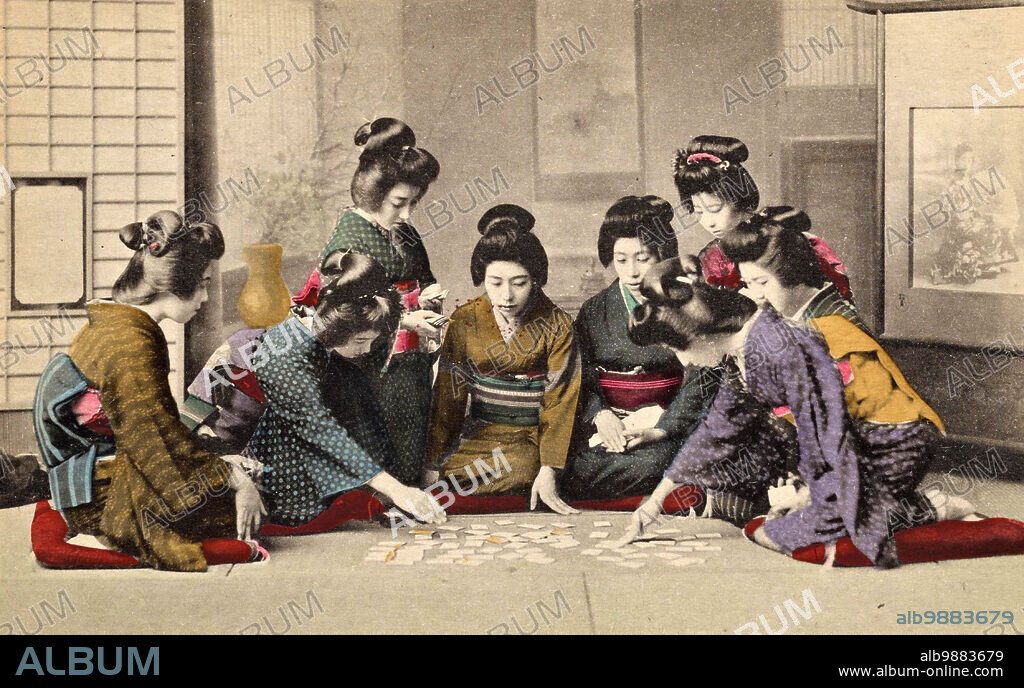 Girls playing Uta-Garuta, a Japanese card game whose cards are based on the poems of the anthology Hyakunin Isshu, circa 1900, Japan, Historical, digitally restored reproduction from a 19th century original.