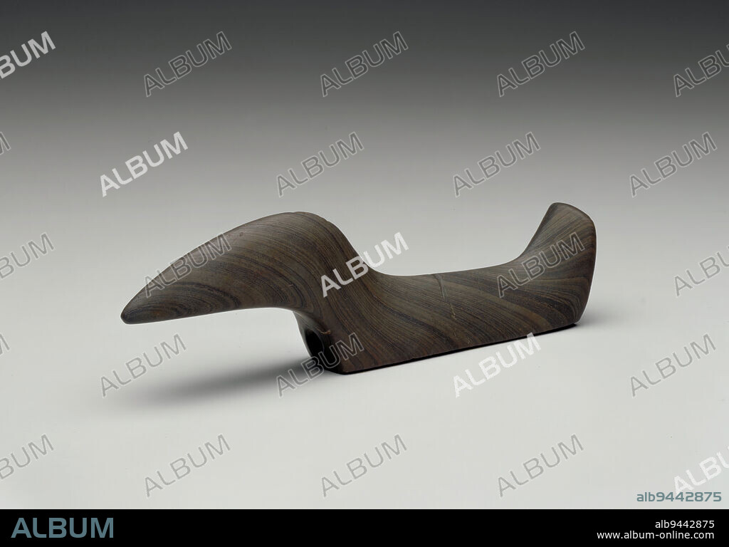 Bird stone, c. 1500-500 BCE, 1-9/16 x 5-1/8 x 13/16 in. (4.0 x 13.0 x 2.1 cm), Slate, United States, 26th-25th century BCE, This simple, abstracted bird shaped stone appears contemporary, yet was made thousands of years ago by a Native American artist in North America. Smooth and graceful, this delicate-looking Bird Stone was used as a ceremonial weight for a hunters atlatl (spear-throwing device). The beauty embodied in this tool may have been carved as an emblem of prestige, a marker of coming of age, a supernatural talisman or as a clan symbol in addition to its utilitarian purpose. These stones were often made from distant materials, another indicator of their importance.