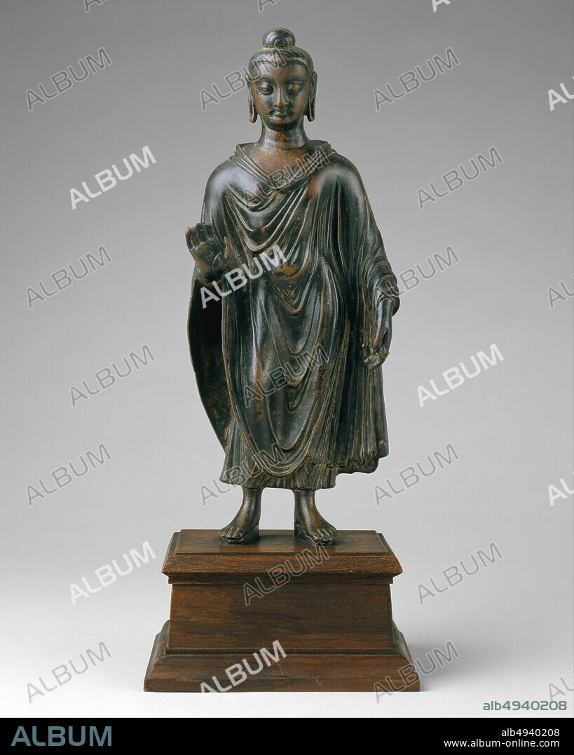 Standing Buddha, Pakistan (ancient region of Gandhara) or Afghanistan, late 6th century, Pakistan (ancient region of Gandhara) or Afghanistan, Brass, H. 13 in. (33 cm); W. 5 1/4 (13.3 cm); D. 2 1/8 in. (5.4 cm), Sculpture.