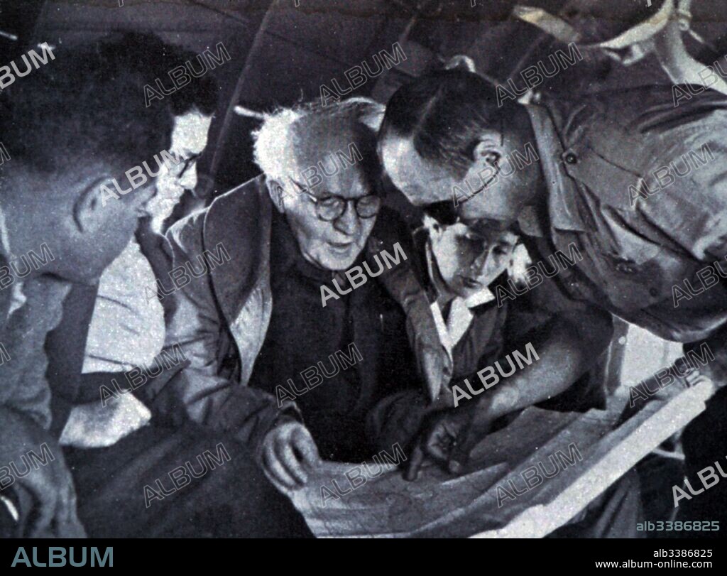 Photograph of Prime Minister David Ben-Gurion (1886-1973) meeting with Moshe Dayan (1915-1981) during the Suez War 1956. Dated 20th Century.