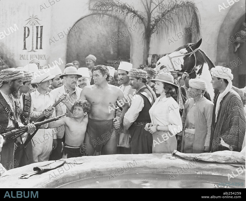 JOHNNY SHEFFIELD and JOHNNY WEISSMULLER in TARZAN'S DESERT MYSTERY, 1943, directed by WILHELM THIELE. Copyright RKO.
