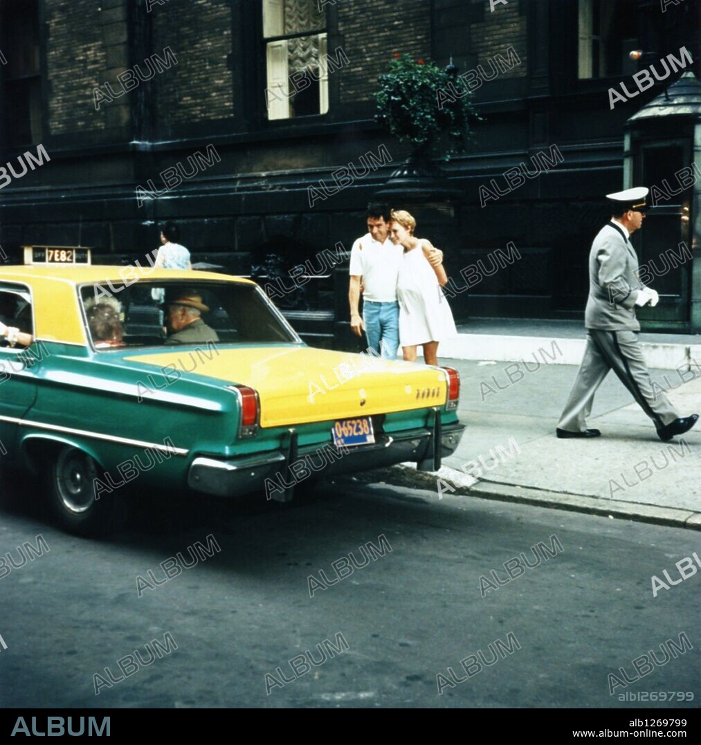 JOHN CASSAVETES and MIA FARROW in ROSEMARY'S BABY, 1968, directed by ROMAN POLANSKI. Copyright PARAMOUNT PICTURES.