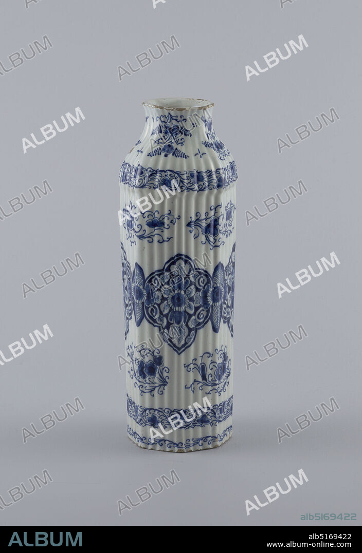 Vase, Jan Jansz Van Der Laan, De 3 Klokken (the 3 Clocks Factory), Tin-glazed earthenware, Tall reeded 8-sided body, bulge at shoulder, tapered neck, slightly flared mouth; painted in underglaze blue on white with large stylized lotus leaf band around center, 3 smaller scroll bands surrounding, and floral/leaf sprays interspersed., Delft, Netherlands, 16801710, ceramics, Decorative Arts, Vase.