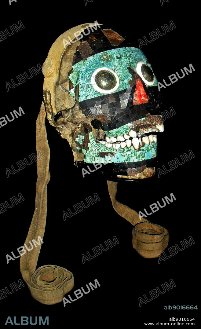 Turquoise mosaic mask of Tezcatlipoca, Mixtec-Aztec, AD 1400-1521. A human skull forms the base for this mask of Tezcatlipoca. 'Smoking Mirror', one of four powerful creator gods in the Aztec pantheon. The Aztec believed that the defeat of Quetzalcoatl by Tezcatlipoca marked the beginning of the current era of creation. The emblem of Tezcatlipoca, an obsidian mirror, symbolises his control over the hidden forces of creation and destruction. The mask is decorated with a mosaic of turquoise, lignite and shell; the eyes have been made from polished iron pyrites. The skull was probably tied around the waist by the leather straps as indicated in the Codex image.