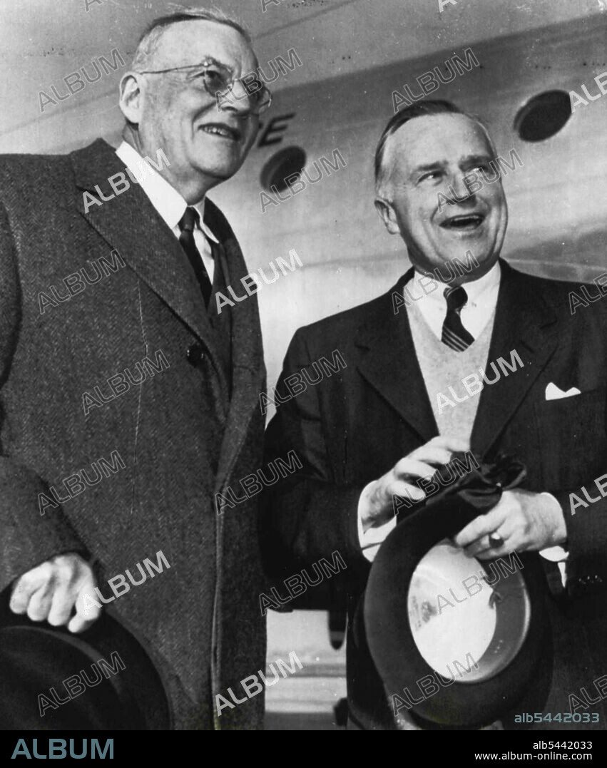 Off For Bankok -- Secretary of State John Foster Dulles and Walter S. Robertson, assistant secretary of state for Far Eastern Affairs, are in light spirits today as they board a plane at national airport on their departure for the Bankok conference of Manila pact nations. Dulles said they would stop at Manila enroute for a meeting with Phillipine President Ramon Magsaysay. February 18, 1955. (Photo by AP Wirephoto).