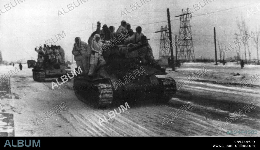 The Leningrad front moves west. Only yesterday German machines were fleeing fro the Red Army along this road. Today soviet tanks are driving in the same direction and the Tommy gunners are shouting to the drivers: "Faster! we must catch the Germans!". May 22, 1944. (Photo by B. Kudoyarov, SIB Photo Service).