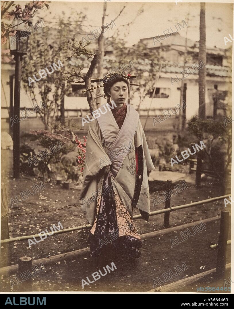 [Japanese Woman in Traditional Dress Posing Outdoors]. Artist: Suzuki Shin'ichi (Japanese, 1835-1919). Dimensions: 25.2 x 19.8 cm (9 15/16 x 7 13/16 in.). Date: 1870s.