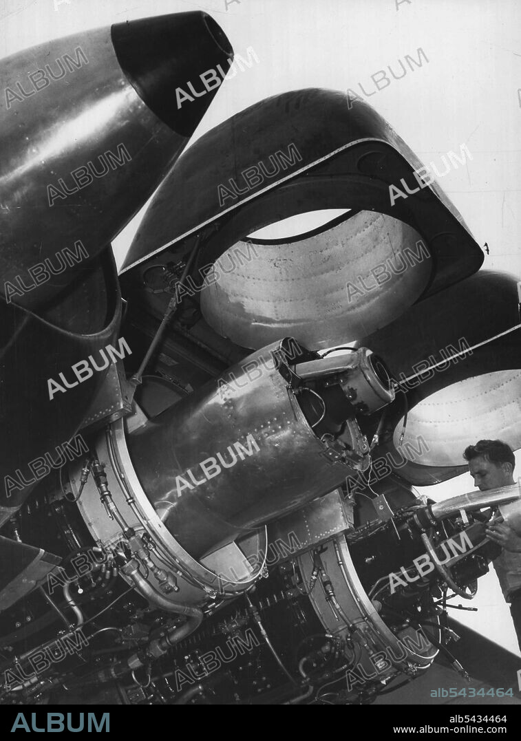 The Lid Is Off Jet Power: First released photograph of the powerful General Electric TG-180 (Allison J-35) jet engines on the Martin XB-48 high-speed, six-jet airplane. Three jet engine are mounted in each wing of the Air Force bomber, now undergoing flight tests at Wright- Patterson Air Force Base, Dayton, Ohio, Cowling on two of the engines have been raised to permit inspection and give some idea of how 11,000 pounds of thrust is produced by each engine. The XB-48 weighs 102,600 pounds and ca.