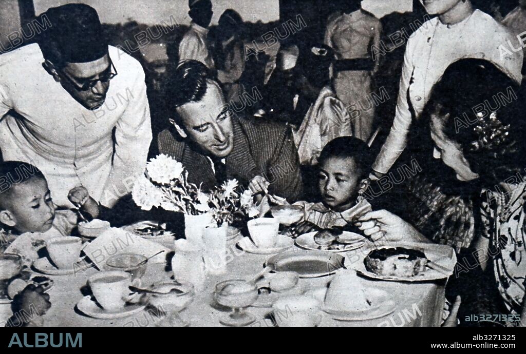 Photograph of the Louis Mountbatten, 1st Earl Mountbatten of Burma (1900-1979) meeting the children of Aung San, a Burmese patriot. Dated 20th Century.