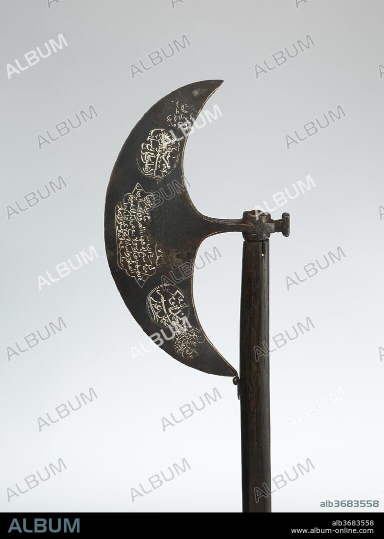 Dervish Ax. Culture: Turkish. Dimensions: L. 52 in. (132 cm); Wt. 3 lb. 2 oz. (1420 g); axehead: 15 3/8 x 8 3/4 in. (39 x 22.1 cm). Date: dated A.H. 1241/A.D. 1825-26.
Large axes with crescent-shaped blades were originally designed for use in battle, but they gradually came to serve as symbols of authority and were carried before a dignitary. They are also associated with religious mystics, Sufis or dervishes, who often exercised considerable political influence, particularly among the Ottoman janissaries (the sultan's elite guard). This late example is decorated in silver with pious Qur'anic inscriptions and verses in Ottoman Turkish by Hatayi, a poet of the Bektashi Order of Dervishes.