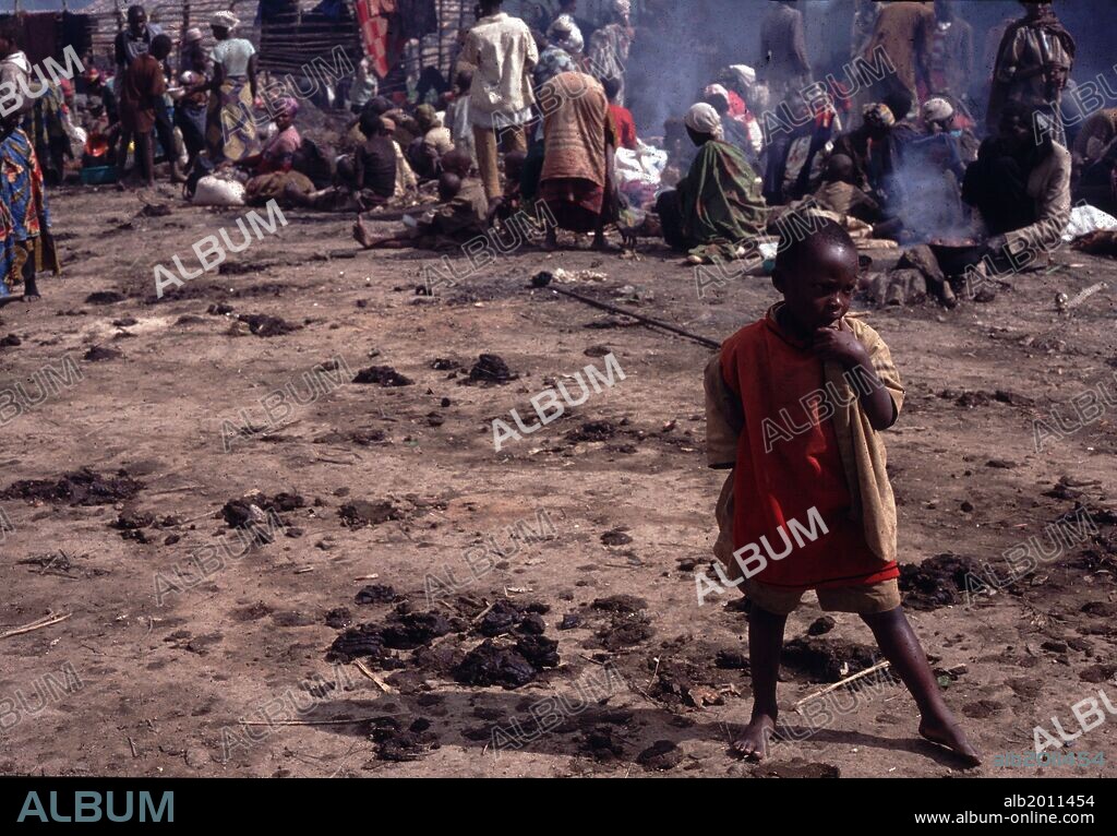 Apr 08, 1994 - Burundi, Rwanda - Rwandan Tutsi refugees flee across the border into Burundi in April 1994 as the Hutus commited genocide in a 100 day civil war. The Rwandan Genocide was the 1994 mass murder of an estimated 800,000 people in the small East African nation of Rwanda. Over the course of approximately 100 days from the assassination of Habyarimana on April 6 through mid-July, over 500,000 people were killed. It was the culmination of longstanding ethnic competition and tensions between the minority Tutsi, who had controlled power for centuries, and the majority Hutu peoples, who had come to power in the rebellion of 1959Ð1962 and overthrown the Tutsi monarchy..(Credit Image: © Theodore Liasi/ZUMAPRESS.com). 08/04/1994