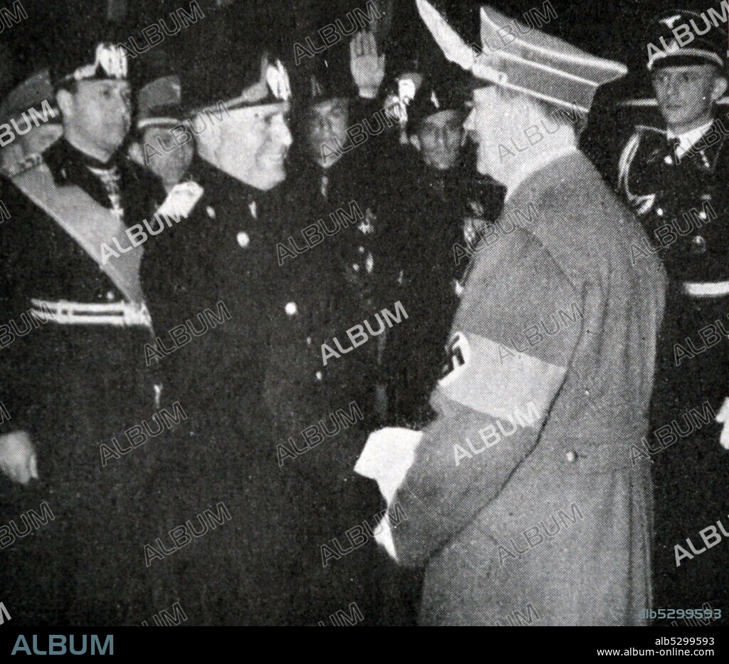 Black and white photograph of Adolf Hitler shaking hands with Benito Mussolini in Florence, May 1938.