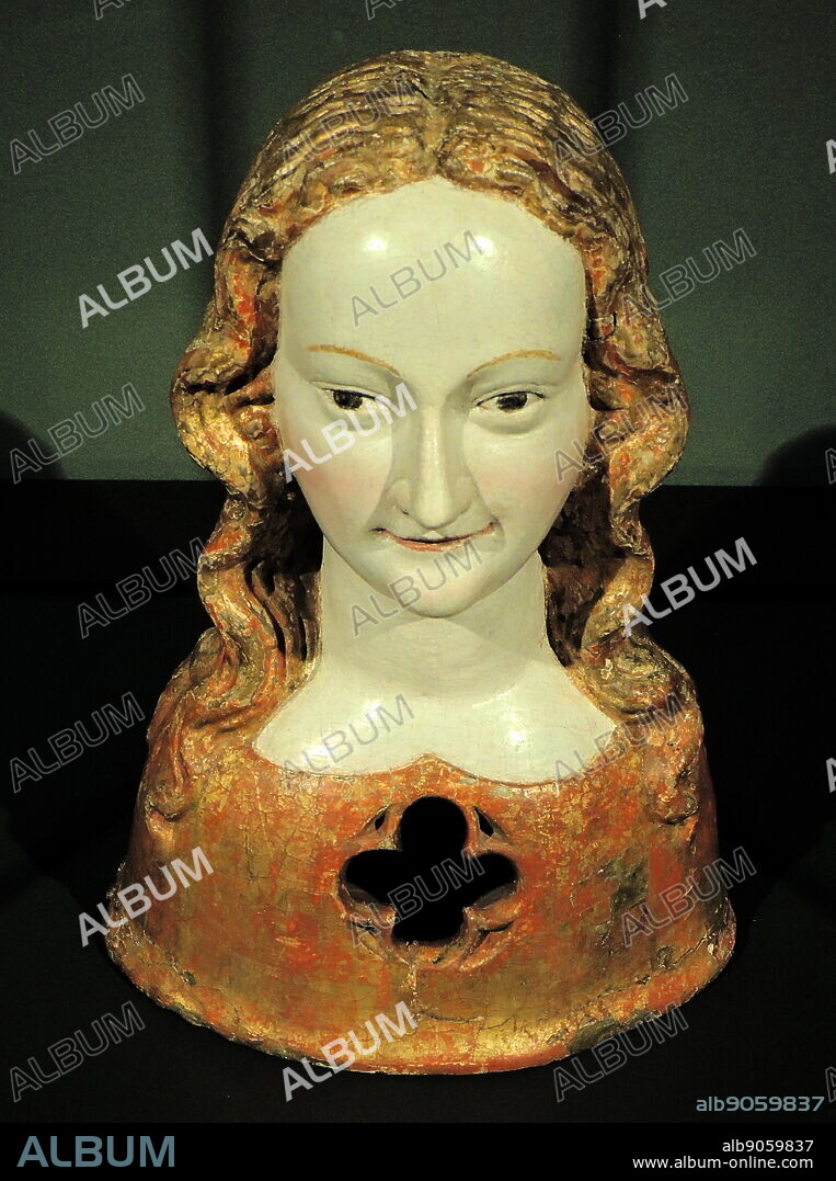 Reliquary bust of one of Saint Ursula's virgins. Cologne, c 1325-1350, walnut with old polychromy. According to legend, the Christian princess Ursula and her retinue of 11,000 virginal handmaidens were murdered near Cologne by Huns. Their numerous relics were preserved in the basilica of St Ursula and other churches. In Cologne, particularly in wooden reliquary busts such as this. The victim's relics could be seen by the faithful through the opening in the bust.