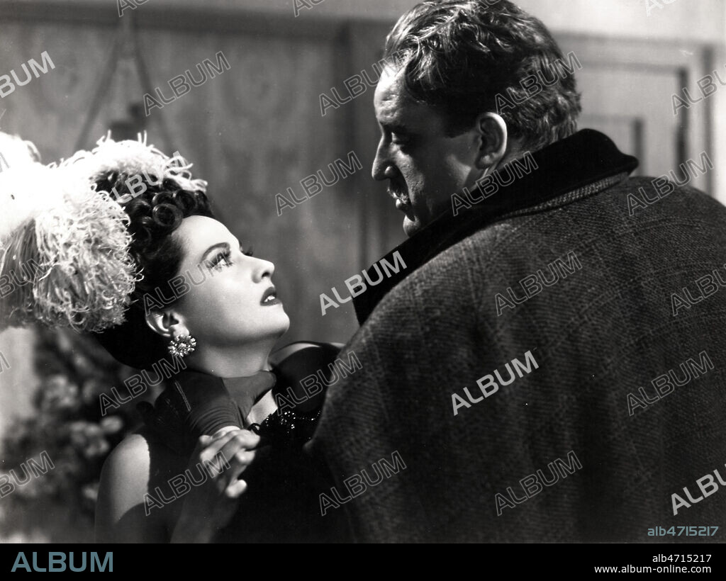 Photo d'exploitation du film 'Jack l'Eventreur' realise en 1944 par John BRAHM, avec Merle OBERON (1911-1979), Laird CREGAR (1916-1944). Credit : Avant-Demain/KHARBINE-TAPABOR.