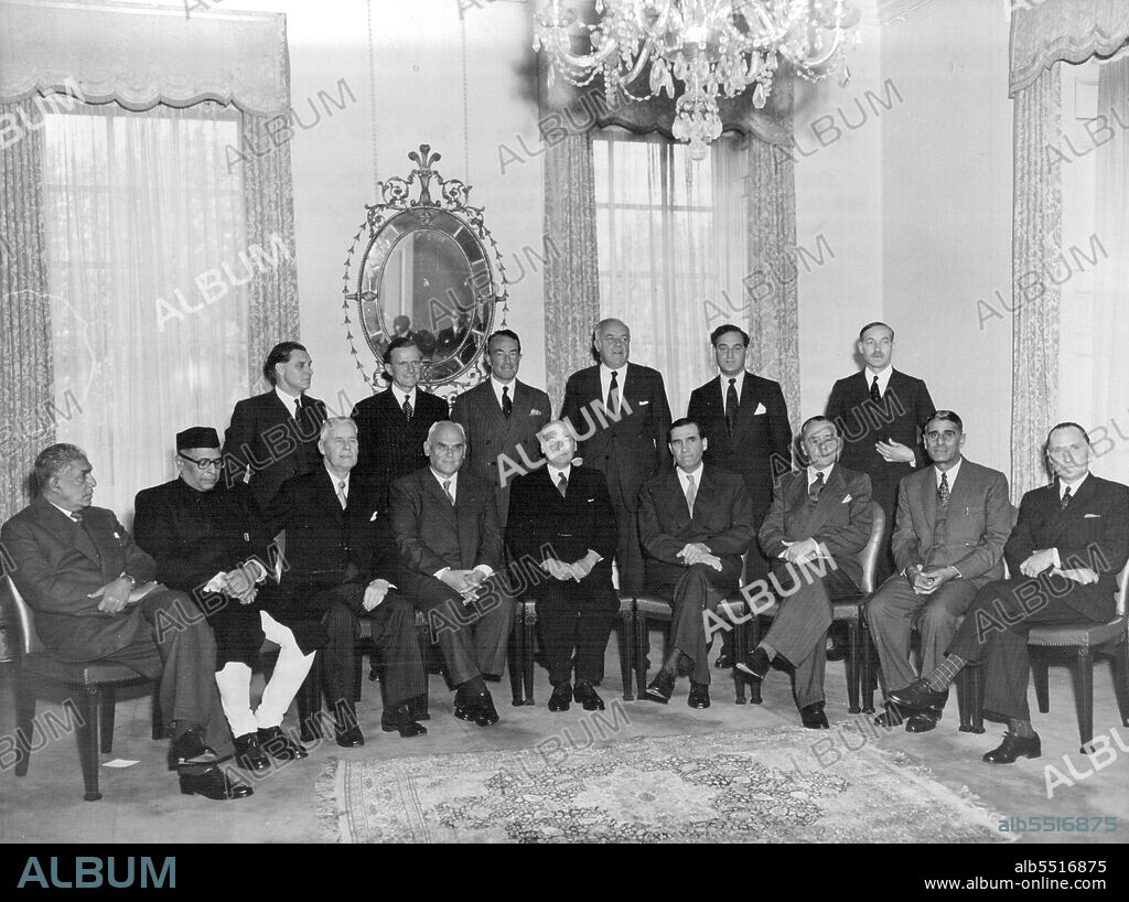 Raw Materials Conference -- Commonwealth Ministers welcomed by the Prime Minister.Front Row, left to right: Mr. E.A.P. Wijeyeratne (Veylca), Mr. H.K. Mahtab, (India), Mr. C.M. Bowden, (New Zealand), Mr. C.D. Howe, (Canada), Mr. Attlee, Mr. J. McEwen, (Australia), Mr. E.H. Louw, (South Africa), Mr. Chaudhri Nazir Almed Khan, (Pakistan), and Mr. W.A.E. Winterton, (Southern Rhodesia). Standing are left to right: Mr. J.E. Edwards, Mr. J. Dugdale, Sir. Hartley Shawcross, Mr. Richard Stokes, Mr. G.R. Strauss and Lord Lucan.The Commonwealth Ministers attending the Conference on Raw Materials held in London were welcomed by the Prime Minister Mr. C.R. Attlee at No.10 Downing Street, before the conference assembled. October 23, 1951. (Photo by United Kingdom Information Service).