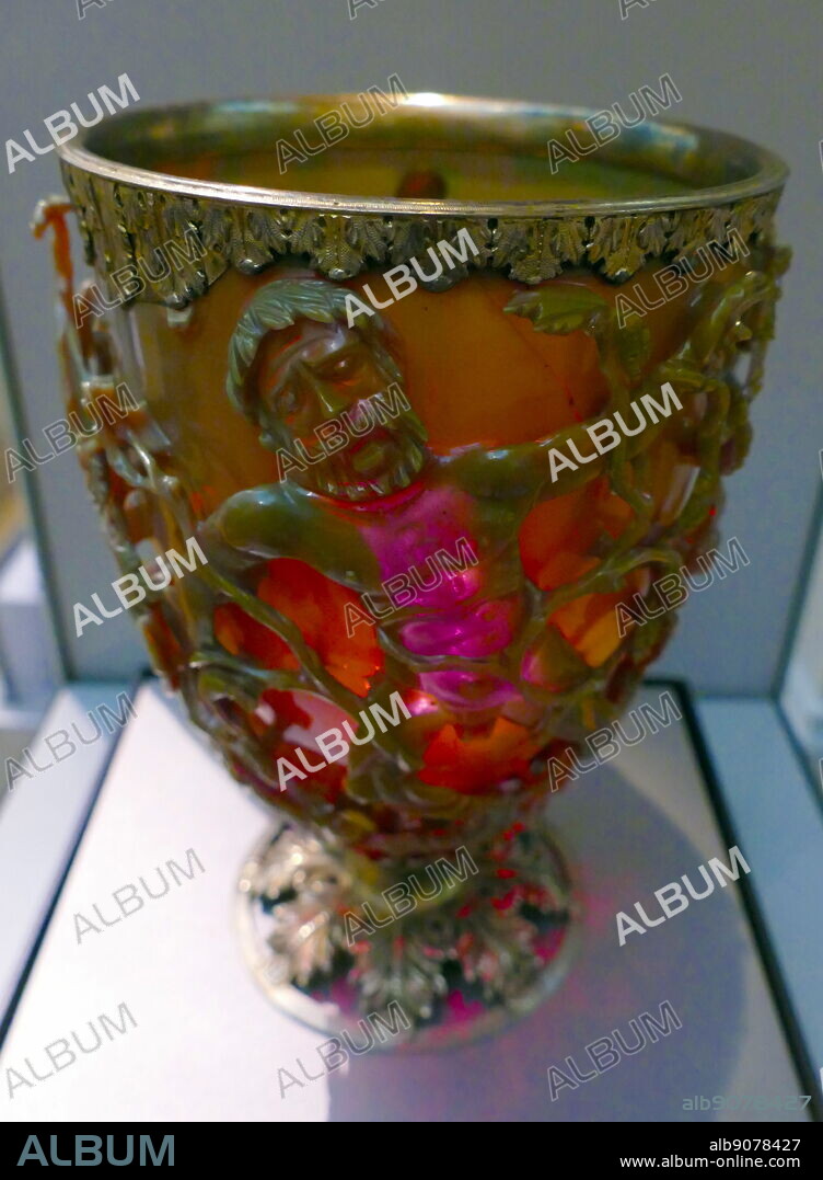 The Lycurgus Cup; 4th-century, Roman glass cage cup. Made of a dichroic glass, which shows a different colour depending on whether or not light is passing through it; red when lit from behind and green when lit from in front. It is the only complete Roman glass object made from this type of glass. The cup is also a very rare example of a complete Roman cage-cup, or diatretum. It named after King Lycurgus.