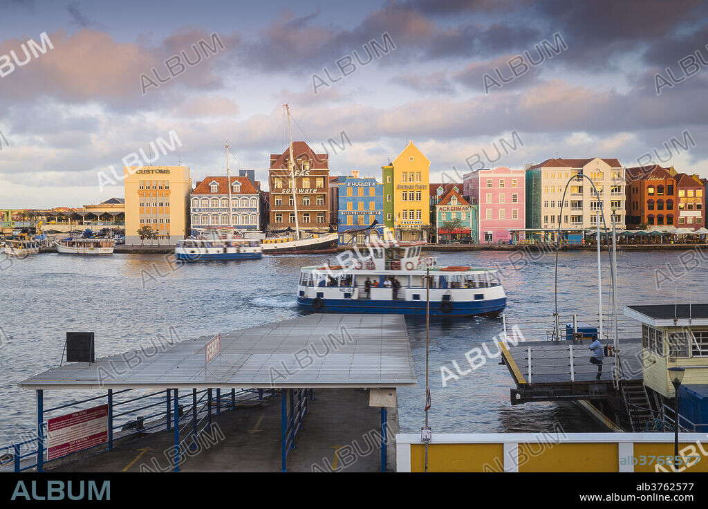 View of Otrobanda ferry terminal and Dutch colonial buildings on Handelskade along Punda's waterfront, UNESCO World Heritage Site, Willemstad, Curacao, West Indies, Lesser Antilles, former Netherlands Antilles, Caribbean, Central America.