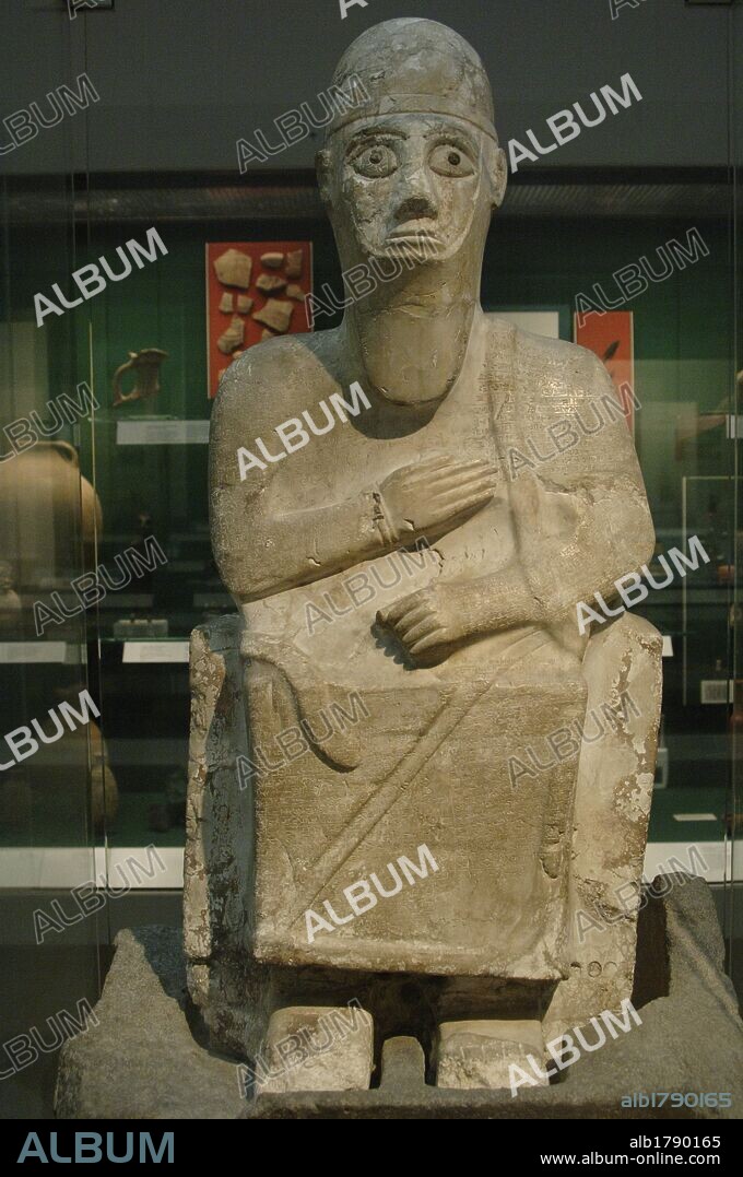 Stone statue of King Idrimi of Alalakh seated in his throne. 1570-1500 BC. British Museum. London. United Kingdom.