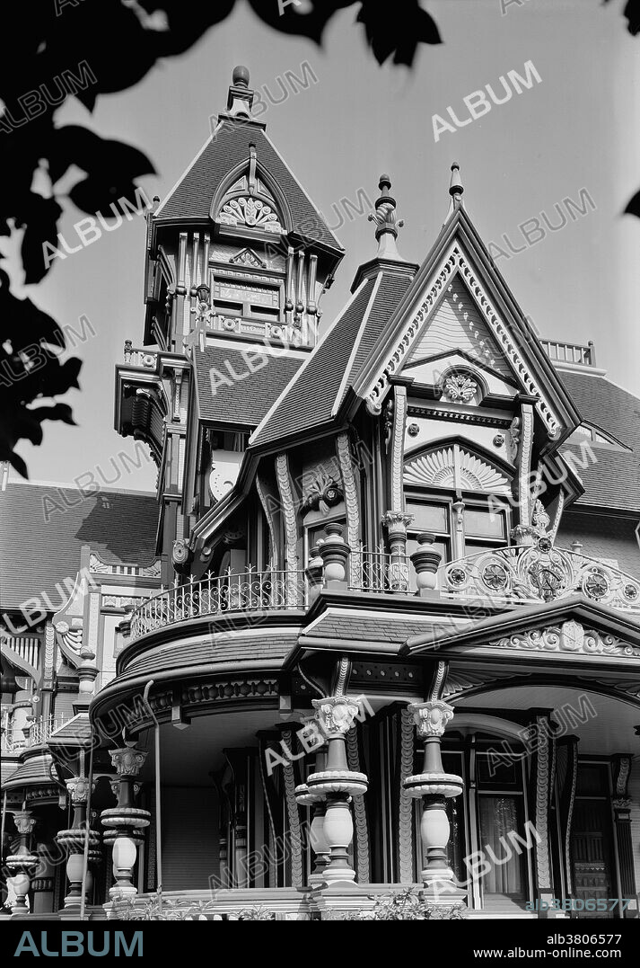 The Carson Mansion is a large Victorian house located in Old Town, Eureka, California. Regarded as one of the highest executions of American Queen Anne Style architecture, the house is "considered the most grand Victorian home in America." Originally the home of one of Northern California's first major lumber barons, William Carson. The Gilded Age mansions were built in the United States in a short historic period spanning between the 1870s until about 1900. Raised by the nation's industrial, financial and commercial elite who amassed great fortunes coinciding with an era of expansion of the railroads, steel and fossil fuels industries, economic, technical and scientific progress, and a complete lack of personal income tax. This made possible the very rich to build mansions designed by prominent architects of its day and decorated with antiquities, furnitures, collectibles and works of art, many imported from Europe. Photographed by Jack E. Boucher, dated 1960.