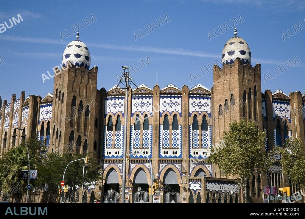 La Monumental Bullring, Barcelona, Spain, 2007. The Monumental Bullring of Barcelona, known as the 'Plaza de Toros Monumental de Barcelona' ('La Monumental' for short), was designed by Ignasi Mas and Joaquim Raspall. It was inaugurated in 1915 with the first bullfights in this place. The building is made of brick and is crowned with four blue and white ceramic egg-like forms. Its style is a mixture of Mudejar (Moorish) and Byzantine. La Monumental houses The Bullfighting Museum of Barcelona.