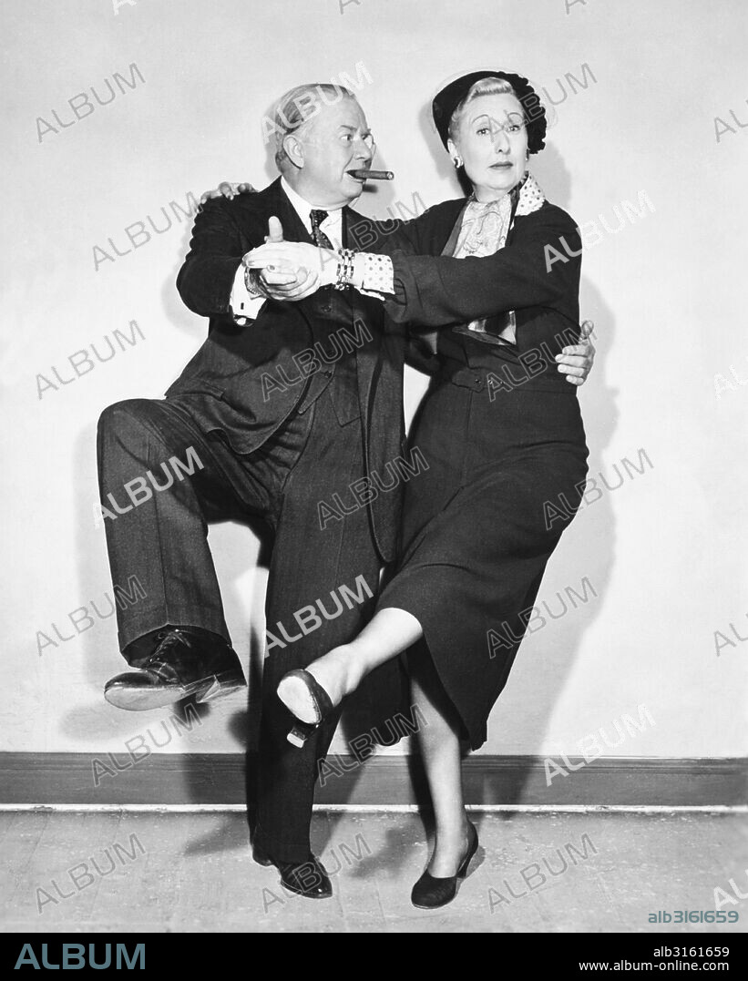 Hollywood, California: c. 1939 Actor Charles Coburn tries dancing the Charleston with his partner.