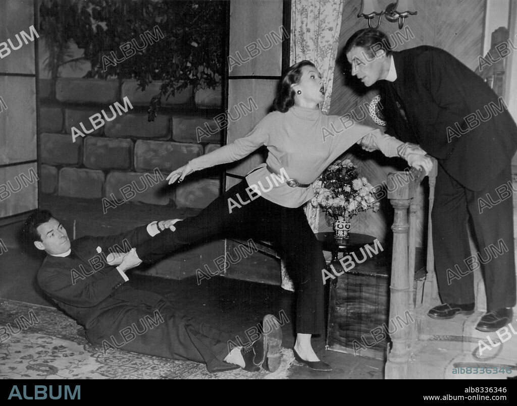 "See How They Run" Recearsal.. At the Palladium today..Hector Ross as Clive & Paul Maloney as the Vicar (right) fight over June Sylvaine as Penelope during a scene in the first act.. of "See How They Run."May 25, 1955. (Photo by George Lipman/Fairfax Media).