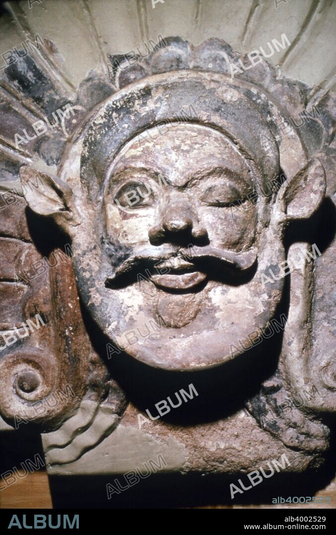 Etruscan Terracotta Antefix, Head of Silenus, from sanctuary of Portonaccio, 6th-5th century BC. In Greek mythology, Silenus was a companion and tutor to the wine god Dionysus. The sanctuary of Minerva at Portonaccio is an archaeological site on the western side of the plateau on which the ancient Etruscan city of Veii, north of Rome, Italy, was located.  At Villa Giulia, Rome.