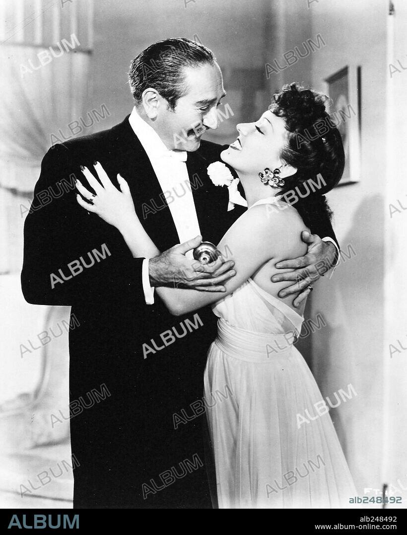ADOLPHE MENJOU and GLORIA SWANSON in FATHER TAKES A WIFE, 1941, directed by JACK HIVELY. Copyright RKO.