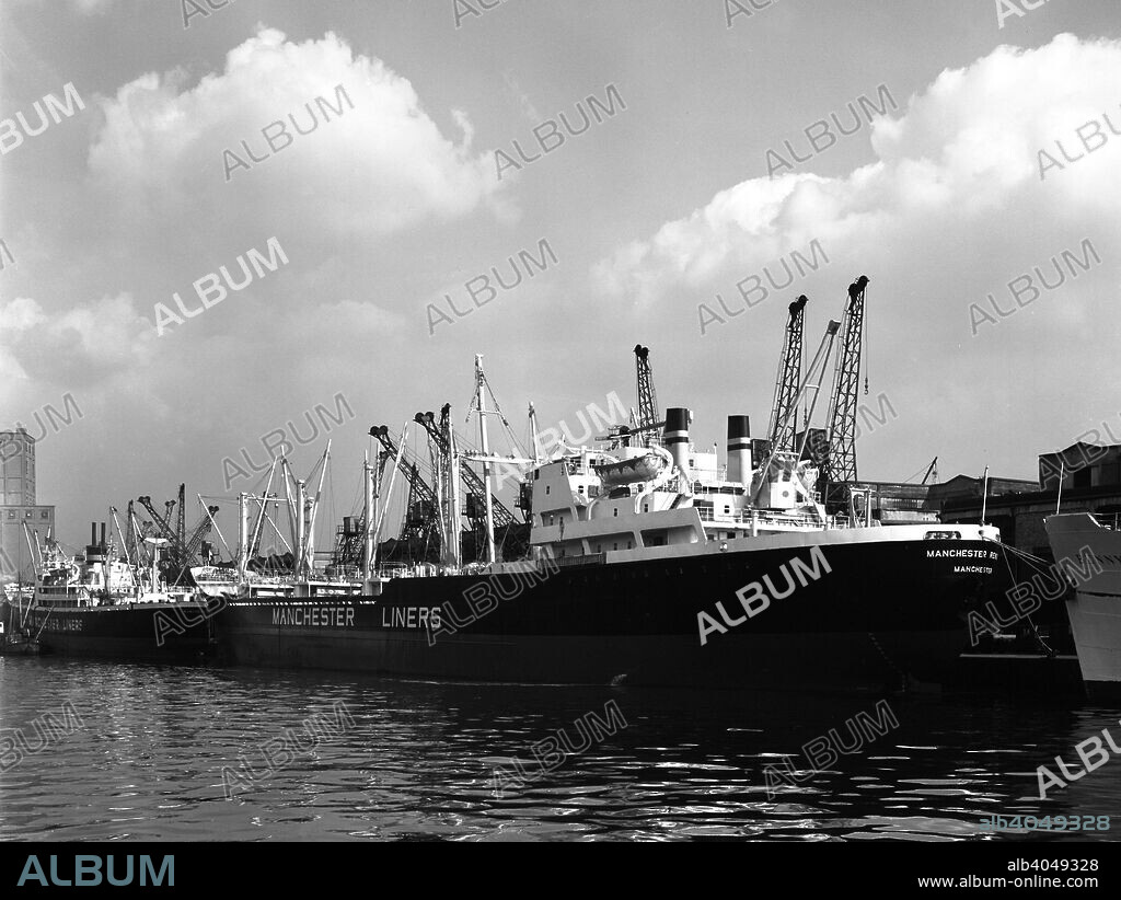 The 'Manchester Renown' in dock on the Manchester Ship Canal, 1964. The 'Renown' was part of the Manchester Liners fleet, which were loaded on the Ship Canal and carried Britain's products worldwide. The 'Renown' was newly built when the photograph was taken in 1964 and was in service with the Manchester fleet until 1971 when it was sold to South Korea and renamed the 'Korean Challenger'.